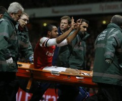Theo Walcott carried off with an injury that would rule him out for 6 months