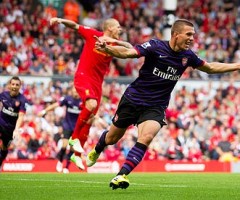 Arsenal's Lukas Podolski celebrates