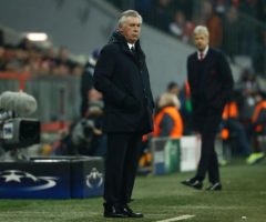 A Manager as his team in the background