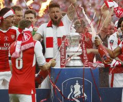 Arsenal players celebrate with the trophy after winning the English FA Cup final soccer match between Arsenal and Chelsea at Wembley stadium in London, Saturday, May 27, 2017. Arsenal won 2-1. (AP Photo/Kirsty Wigglesworth)