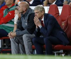 Arsene Wenger watches on
