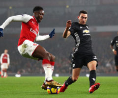 Damian in action against Arsenal, closing down Danny Welbeck